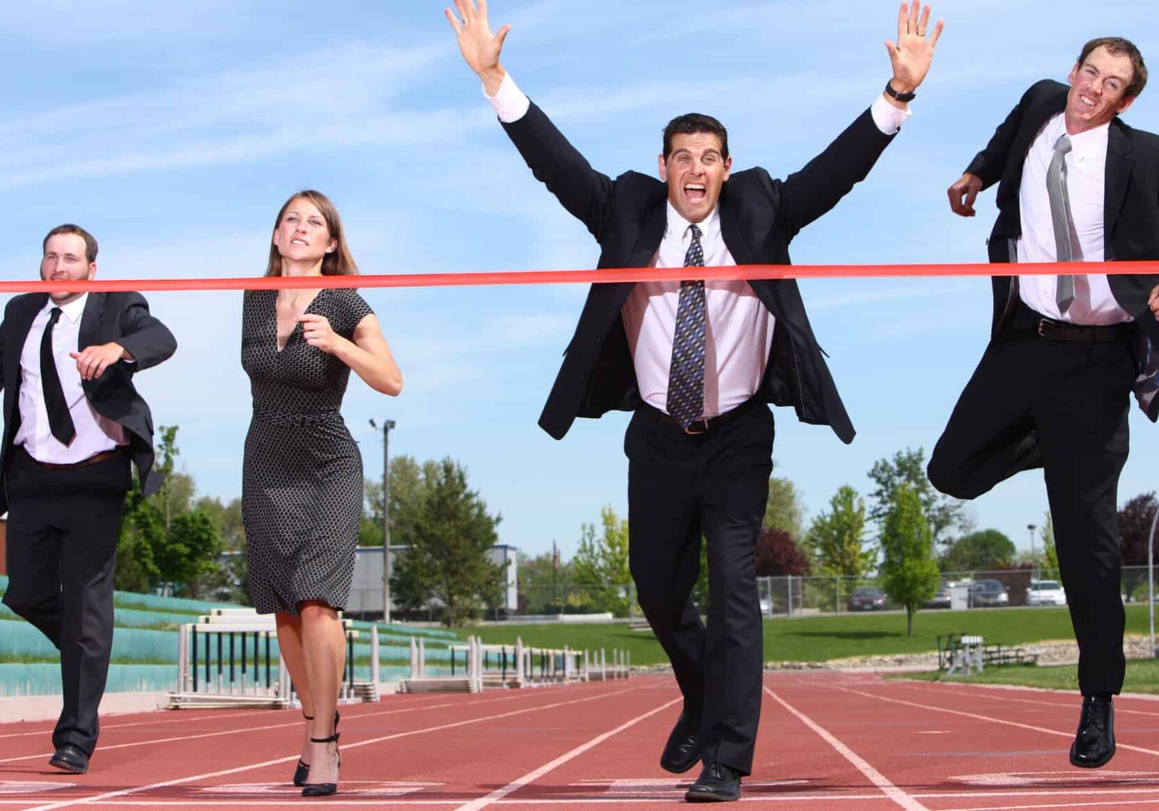 ASX 300 share investors in suits running a race on an athletics track